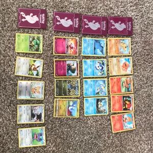 18 Pokémon cards and 4 card holders